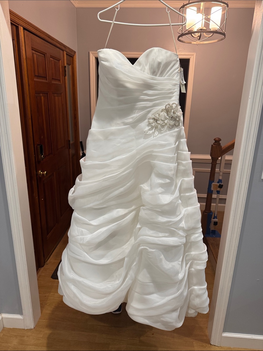 Strapless White Wedding Gown with Ruched Skirt and Side Embellishment